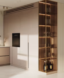 Modern kitchen with beige cabinetry and a glass display shelf illuminated by warm lighting